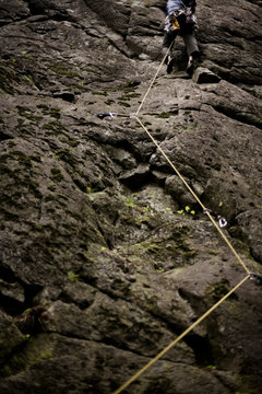 Climbing rope zig zags through climbing protection placed by the lead climber at the top of the frame.