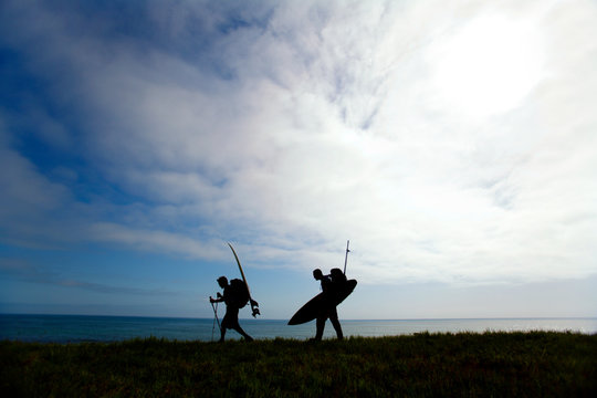 Dan Duane and Jeff Daniel hike with their surfboards while on a surfing and backpacking trip to The Big Flat located eight miles north of Shelter Cove on The Lost Coast, California.