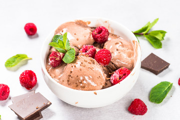 Chocolate ice cream with raspberries.