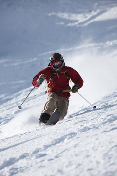 A male telemark skier rips turns in Bridger Bowl, Montana.
