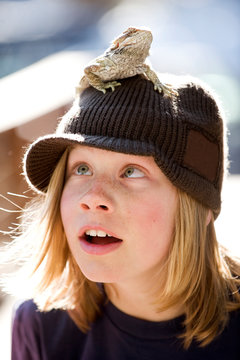 Dylan Zellers poses with a bearded dragon while playing outdoors in Lake Tahoe, California.