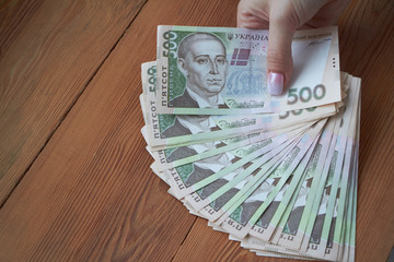 Ukrainian national currency, bills of different values, the calculation between people, the transfer of money.