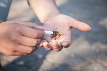 Woman hand cigarette in outdoor.