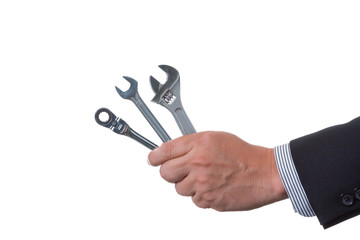 Mechanic engineer holding many kind of wrench in his hand; handing tool on white background with clipping path