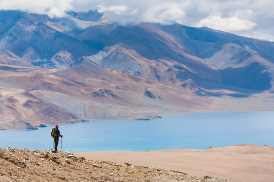 A woman is hiking toward Tsomoriri, Chnagtang region, Ladakh, India.