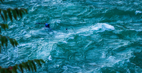 man drowning  as losing balance while kayaking 