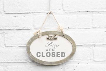 Cute sign board with text sorry we're closed today