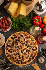Pizza with hunting sausages, mushrooms and olives