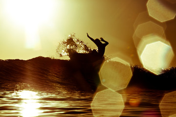 A male hit the lip of a wave while surfing at Rincon State Beach, in Santa Barbara, California on November 5, 2012.