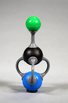 Molecule model of potassium cyanide. Green = Potasstium, black = Carbon, blue = Nitrogen.