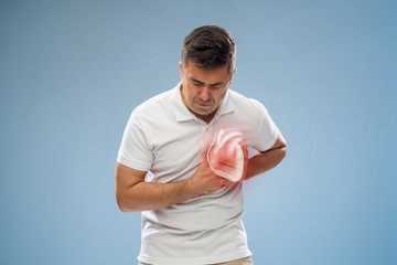 people, healthcare and health problem concept - unhappy middle-aged man having heart attack or heartache over blue background - obrazy, fototapety, plakaty