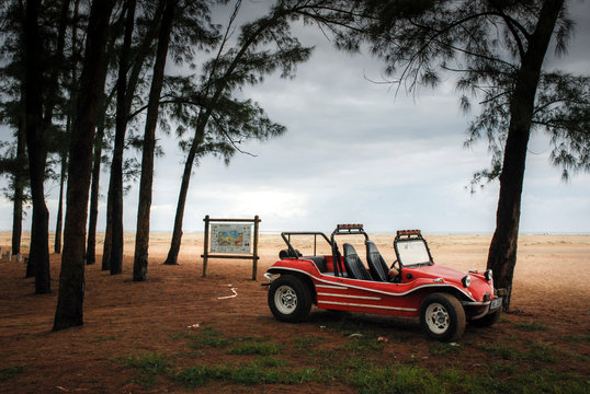 Vintage dune buggy on the coast of South Africa just after dawn.