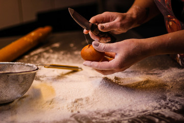 The chef mixes the dough from flour and eggs. Smoke flour Sifting flour. Chef's hands. Kitchen processes