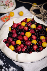 homemade puff pastry pie with cherry plums, blueberries and strawberries