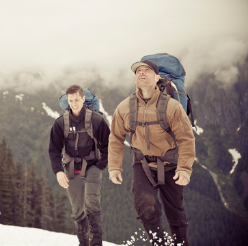 Two backpackers appraoch Grainger Peak near Harrison Lake, BC, Canada.