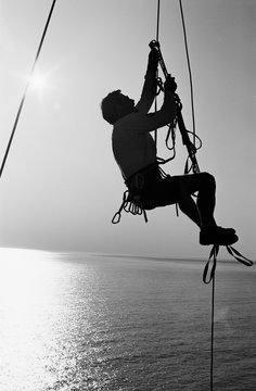 Silhouette of a man jumaring over the Pacific Ocean at Mickeys Beach, Marin County, California.