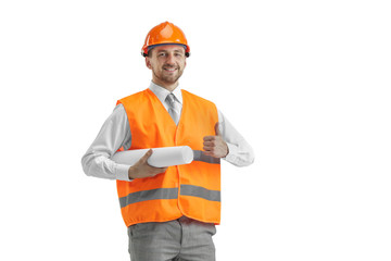 The builder in a construction vest and orange helmet standing on white studio background. Safety specialist, engineer, industry, architecture, manager, occupation, businessman, job concept