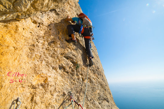 Man climbing cliff at Sierra de Toix