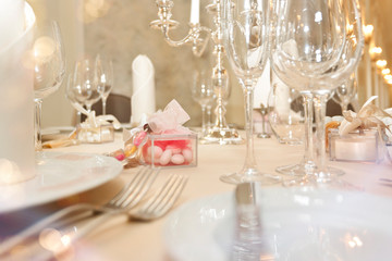 Festive covering table with glasses and presents