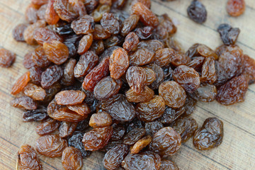 group of raisins on wooden table