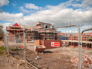 Security gate with No Entry warning sign on new housing estate in Cheshire UK