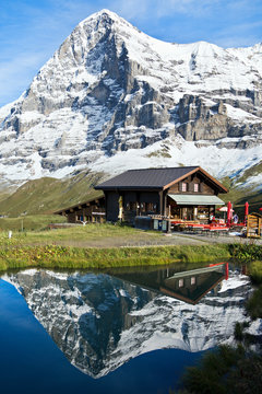 View of Kleine Scheidegg mountains reflected in lake