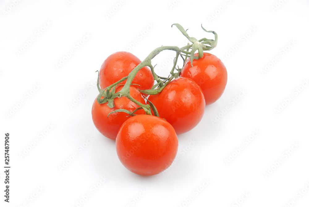 Wall mural bunch of tomatoes on a white background