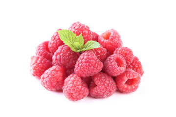 Ripe raspberries with green leafs isolated on white background