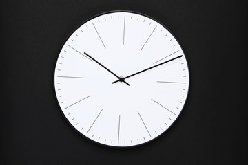 Round clock on black background