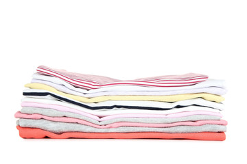 Stack of folded clothes on white background