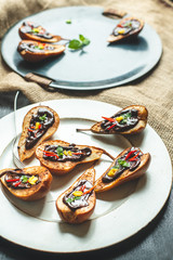 pear baked on butter with cinnamon and sugar spread with hot dark chocolate with the addition of chopped leaves mint, strips of hot chili and grated lemon peel