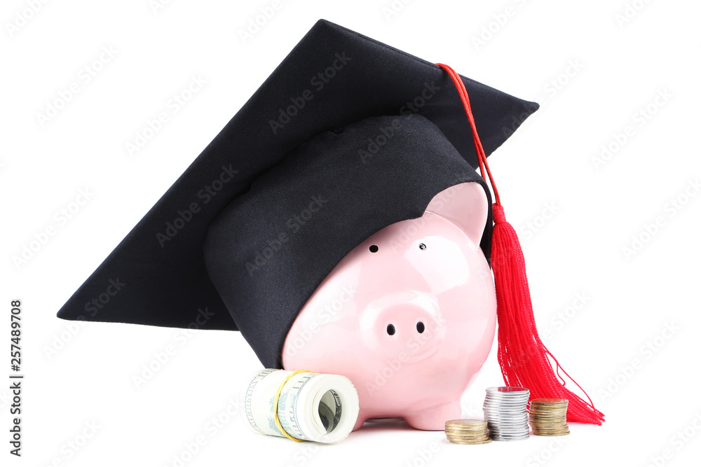 Wall mural Piggybank with graduation cap, coins and dollar banknotes isolated on white background - Wall murals