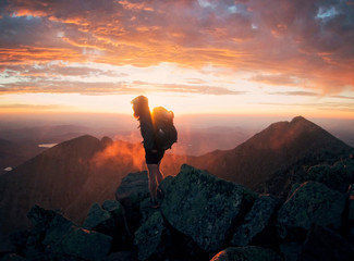 A hiker begins his sunrise traverse of the Knife edge on Maine's Mount Katahdin.