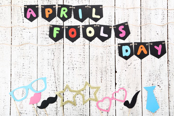 Inscription April Fool's Day on wooden background