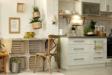 Modern kitchen interior with wooden crates as eco furniture