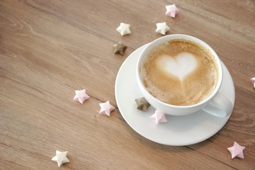 cup of cappuccino with heart-shaped foam.