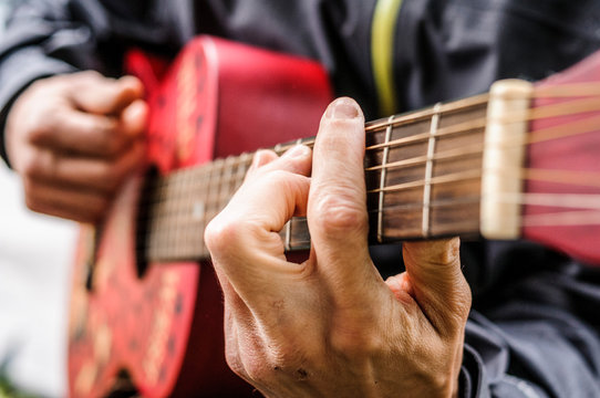 Man playing guitar, Val di Mello, Val Masino, Italy