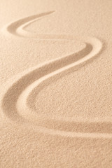 Sand texture background with line pattern. Minimal zen meditation garden. Concept for yoga, spa wellness or buddhism and mindfulness.  With copy space.