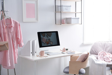 Comfortable workplace with computer on desk in home office