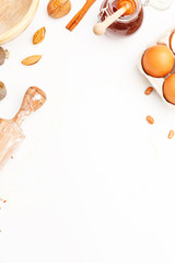 A set of kitchen items for baking sweet flour products. Flour, eggs and other ingredients. Top view. Copy space.