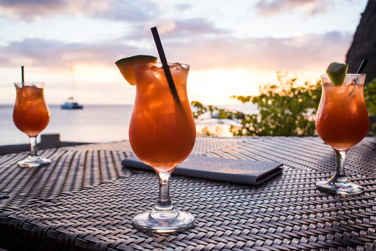 Glasses with drink standing on table during sailing cruise