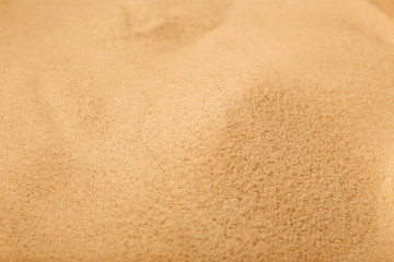 Dry sand on beach as background, closeup
