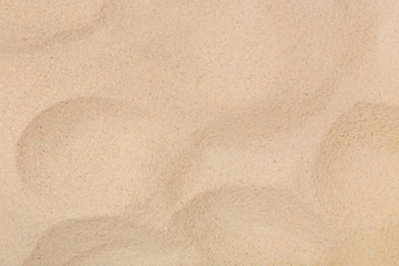 Dry beach sand as background, top view