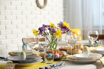 Festive Easter table setting with traditional meal at home