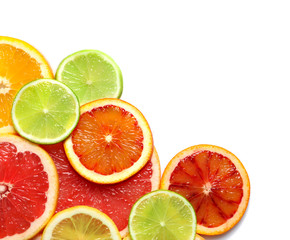 Fototapeta na wymiar Slices of fresh citrus fruits on white background, top view