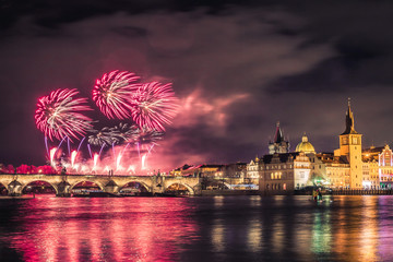 Beautiful fireworks above Charles bridge at night in Prague, Czech Republic.