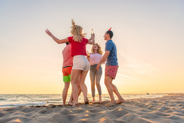 Group of friends enjoy on the beach
