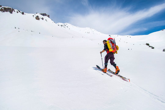 Man cross country skiing towards Mt Shasta, California, USA