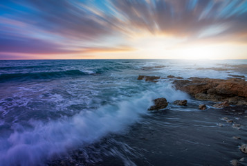 Sunset over the sea and beautiful long exposure clouds. Greece, Crete island.