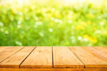 Real wood table top texture on blur flower garden background